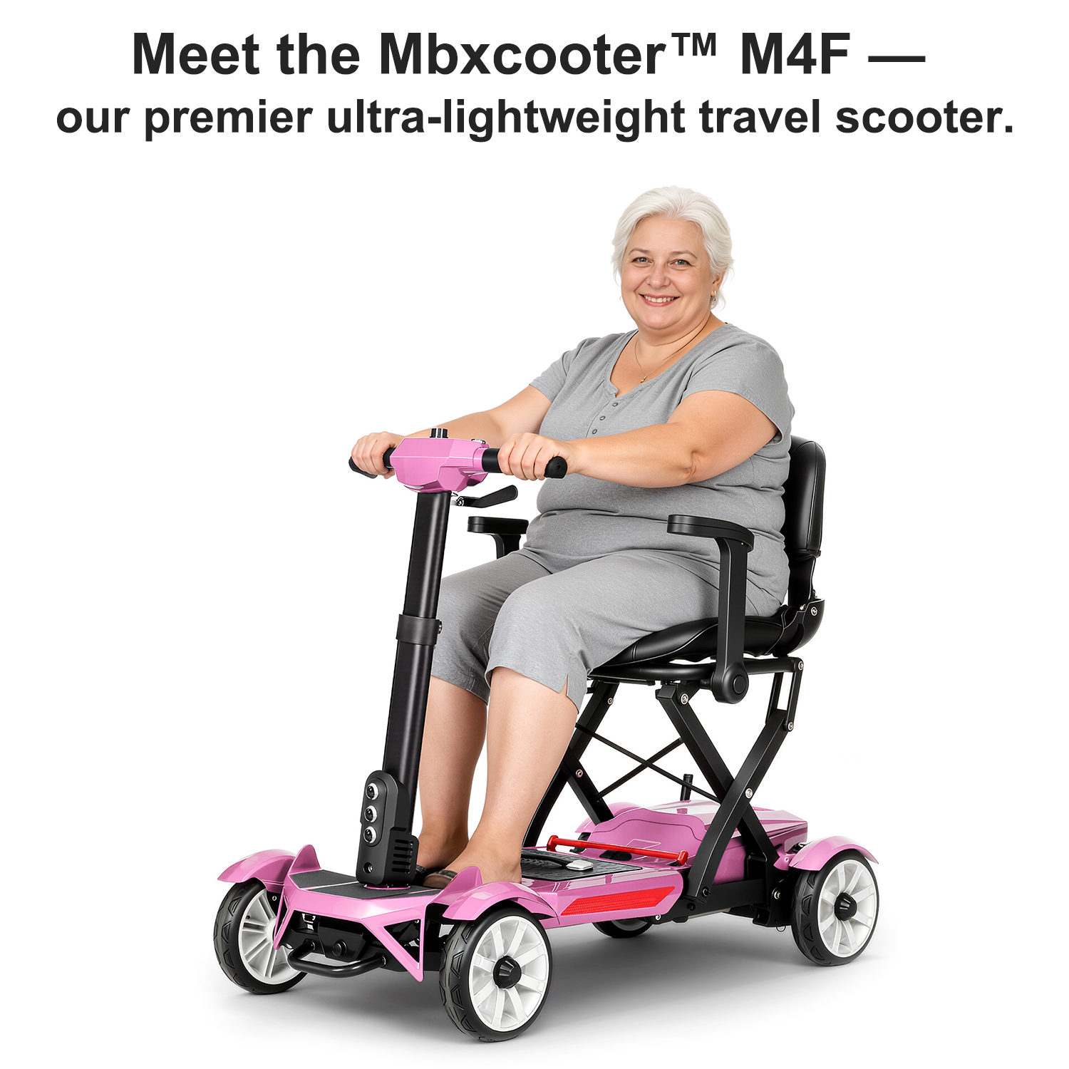 Mbxcooter M4F pink mobility scooter with a woman riding it.